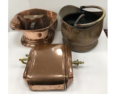 A 19th Century copper water fountain, the lidded cistern and brass dolphin head spout, above a flared basin on pedestal foot,
