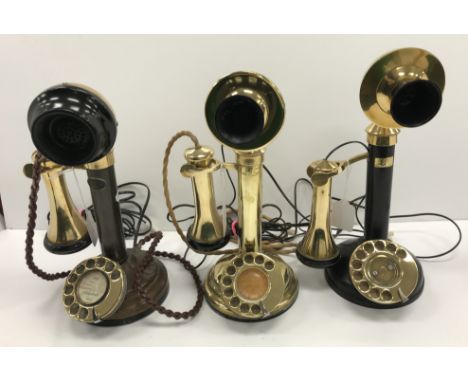 A vintage GEC brass and black metal candlestick telephone 32 cm high together with a vintage Siemens Brothers & Co Ltd of Lon