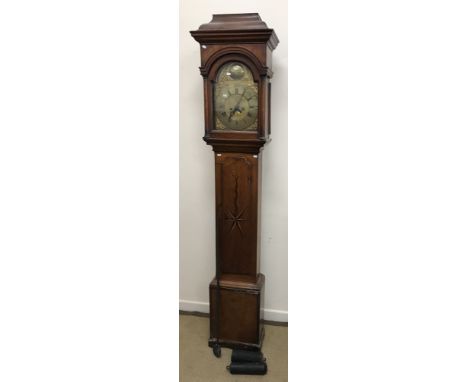 A late 18th Century oak cased long case clock, the eight day movement with brass arch dial bearing medallion inscribed "Ed.We