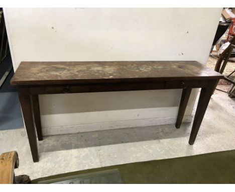 A modern Indian teak side table, the plank top over two frieze drawers with plain ring handles, raised on square tapered legs