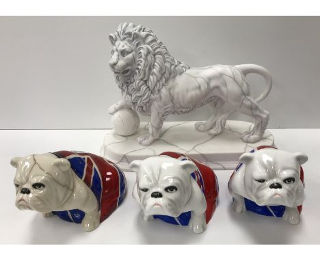 A collection of three Royal Doulton "Jack" pottery figures of bulldogs with Union flag decoration, including one "Skyfall", a