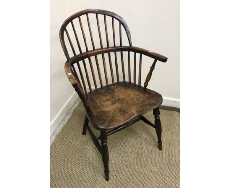 A 19th Century Thames Valley yew wood, beech and elm stick back chair with hoop top rail and yoke arms on turned supports to 