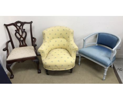 A Victorian upholstered scroll arm salon chair on turned front legs to horn castors, 77 cm wide x 81 cm high together with an
