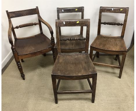 A set of three 19th Century Norfolk bar back dining chairs with turned back rails and dished seats on square tapered legs uni