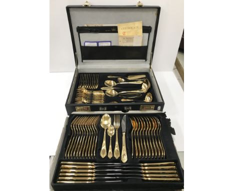 An SBS Solingen 23/24 CT gold plated canteen of cutlery, twelve place settings comprising, knives, forks, spoons, teaspoons, 