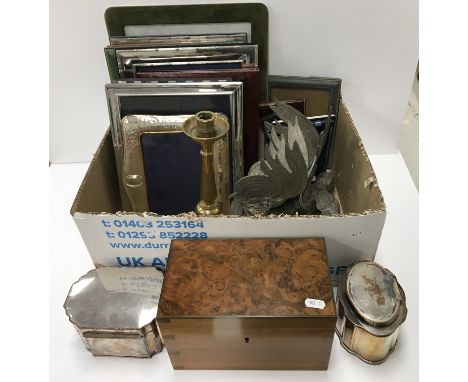A box containing 17 various photograph frames, a plated on copper tea caddy, a plated on copper biscuit box and cigar piercer
