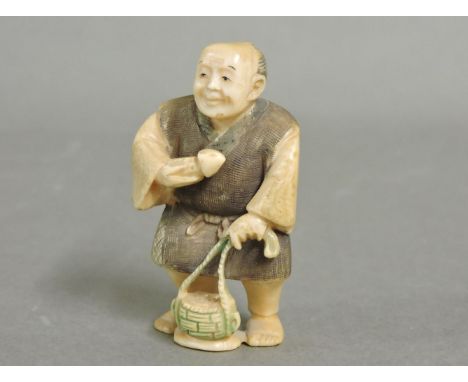 A Japanese netsuke, a mushroom gatherer, signed, 5cm high