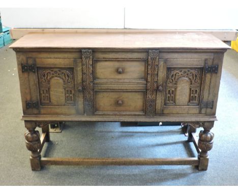 An Ercol type oak dresser base, 122cm wide