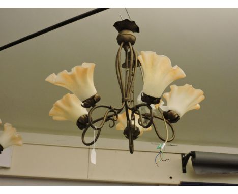 A pair of five light electroliers, with blush shades
