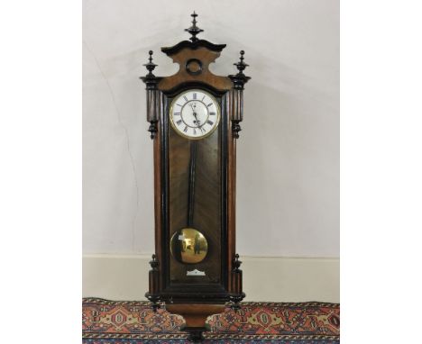 A 19th century Vienna regulator wall clock, with a walnut and ebonised case, and a single train weight driven movement, 122cm