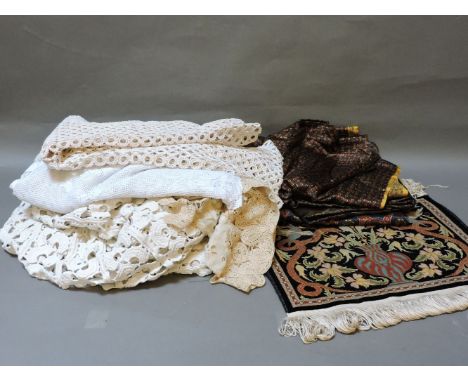 Two boxes of fabrics, table cloths, bed covers and modern fringing, embroidered rope, etc