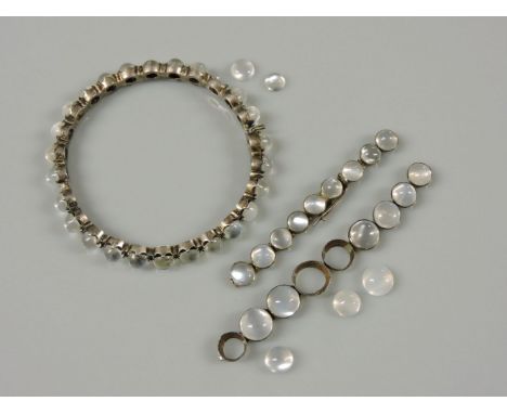 A moonstone hinged bangle, one stone deficient, and a moonstone bracelet, broken and three stones deficient, and five loose c