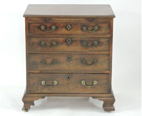 A small George III mahogany bachelor's chest, with brushing slide and ogee bracket feet, 69cm wide