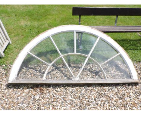 A white painted fan window light, 193cm wide