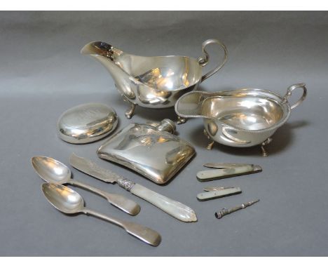 Two silver sauceboats, a tobacco box and cover, a silver hip flask, two mother of pearl and silver penknives, a propelling pe