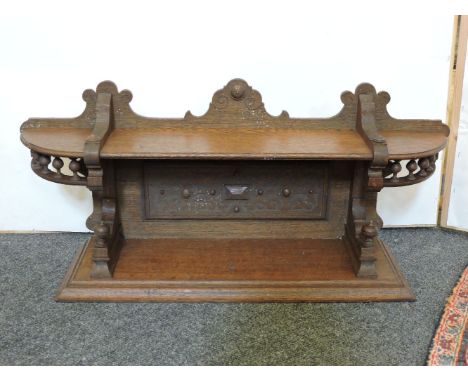 A 19th/20th century French Gothic Revival oak wall shelf, 82cm wide