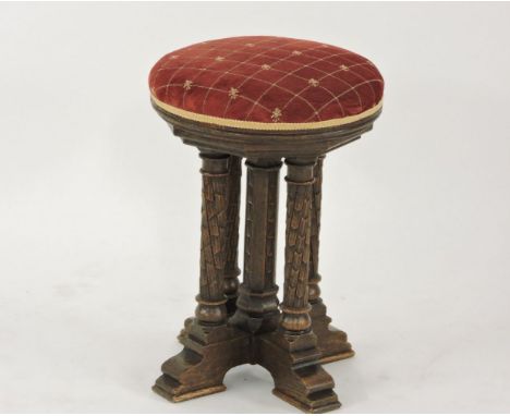 An oak Gothic Revival adjustable music stool