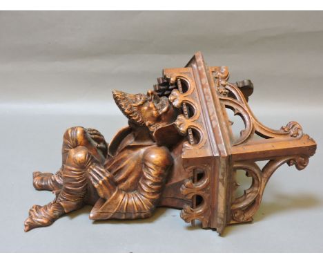A French carved walnut bracket, 52cm high