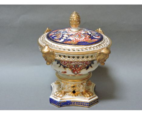 A Crown Derby pot pourri, with a pierced cover and handles, and a pine cone finial, 18cm high