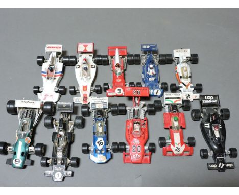 A collection of die cast toys and Action Man