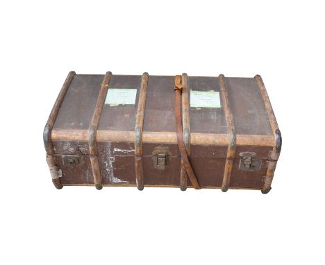 An early 20th century travel trunk - brown canvas covered with beech laths and leather handles, 89 x 55 x 32cm.