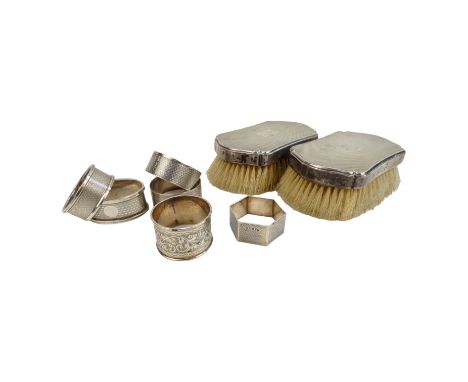 A pair of silver backed brushes - London 1936, William Comyns &amp; Sons Ltd, shaped rectangular form with engine turning, to