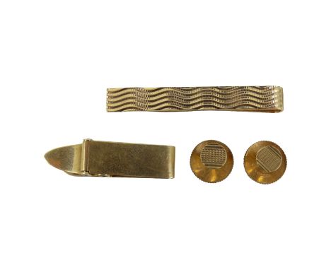 A 9ct gold tie clip - rectangular with wave form engine turning, together with another 9ct clip and pair of shirt studs, 9.8g