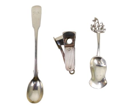 A continental caddy spoon - bearing marks to bowl, together with a pickle spoon and a cigar cutter. (3)