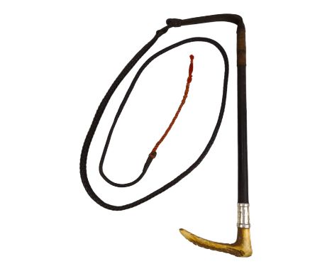 A horn handled whip - with silver mounts, makers label for Swaine &amp; Adeney.