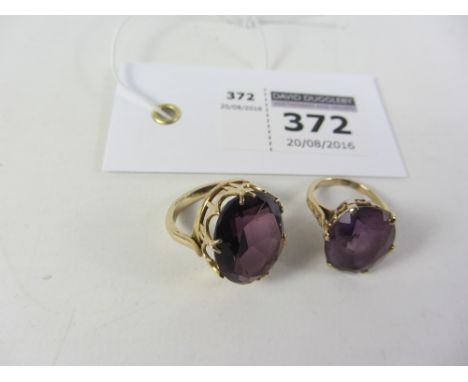 Ring set with a large amethyst stamped 9ct and a similar unmarked ring Condition Report Click here for further images, condit