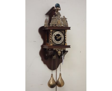 Late 20th century Dutch weight driven wall clock, elaborate brass work pediment mounted by figure finial, over brush metal ch