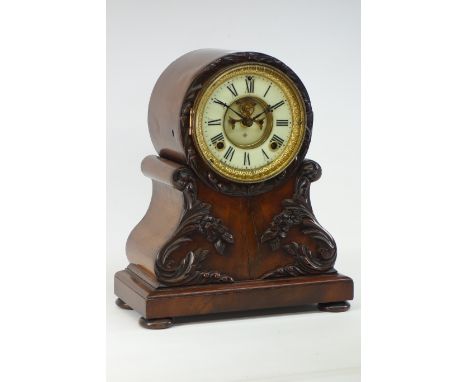 19th century mahogany and figured mahogany mantel clock fitted with decorative carved mounts, circular dial, movement signed 