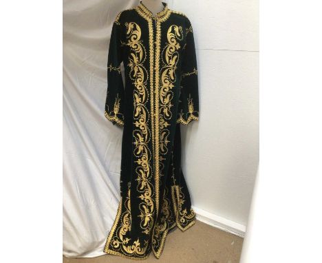 Women's green velvet full length coat with embroidered abstract scrolling foliage. Knotted button and loop fastenings.Conditi