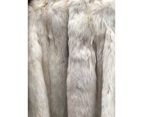 Vintage fox fur 3/4 length coat with stand up collar and wide sleeves.