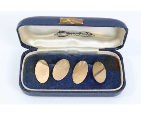 Pair 9ct gold oval panel cufflinks with engine turned decoration, in case  Condition report: Both hallmarked 9ct gold and wei