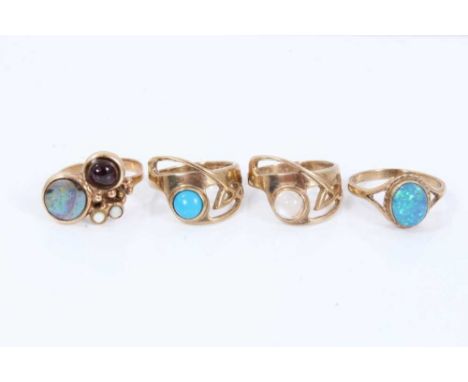 Four 9ct gold rings set with semi precious stones to include turquoise cabochon ring in abstract setting and same style moons