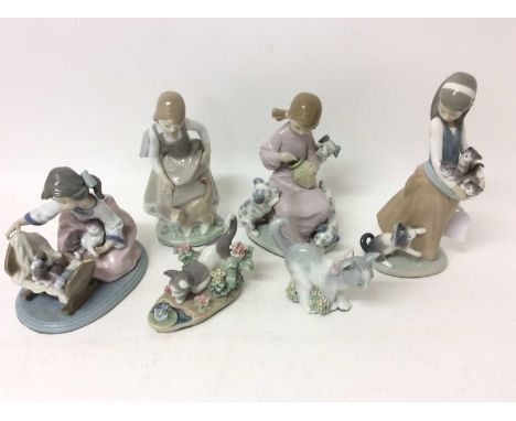 Four Lladro or Nao porcelain figures of girls with cats and dogs and two cats with floral encrusted decoration (6)Condition r