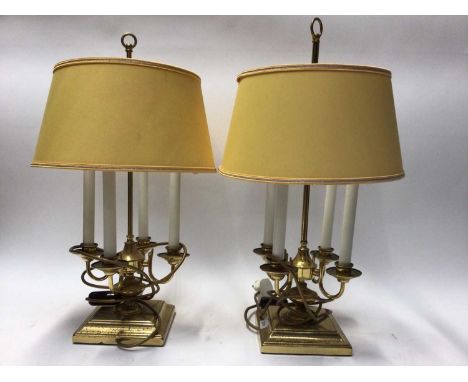 Pair of brass four-branch lamps and shades, together with a library lamp with green shade
