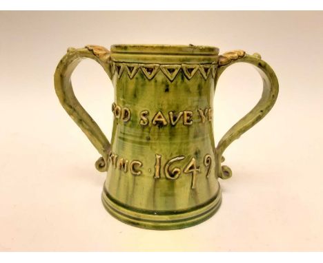 Castle Hedingham Edward Bingham green glazed pottery two handled tankard decorated with script - God Save Ye King 1649 and Dr