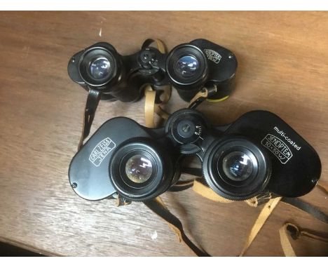 Two pairs of Carl Zeiss Jenoptem binoculars, 10 x 50W and 8 x 30W respectively, the first with leather case, second with asso
