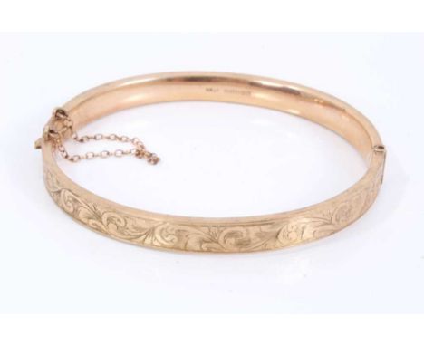 9ct gold bangle with engraved scroll decoration, Birmingham 1940, 6.5cm x 5.5cmCondition report: Weight 7 gramsEngraved on ba