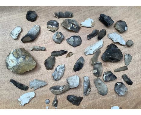 One box of worked flint tools, axe heads and other flint items, some bearing old collection labels