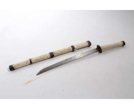 Japanese Wakizashi in ornately carved bone scabbard with Figural decoration, blade 33cm in length