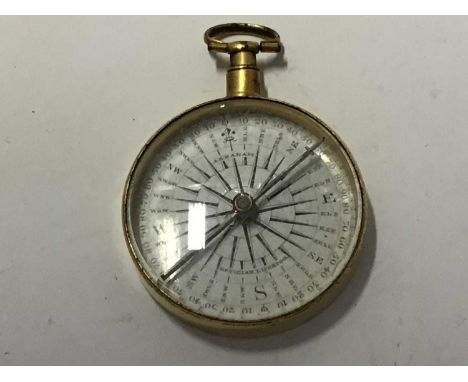 Early 19th century pocket compass in gilt case by Abraham of LiverpoolCondition report: Good overall condition, the glass has