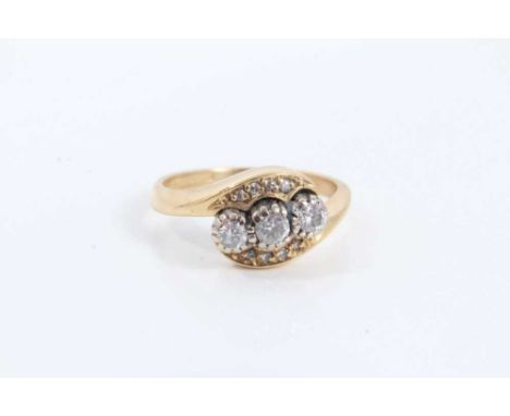 18ct gold diamond three stone ring in diamond set crossover setting. Ring size K½Condition report: Weight 4.1 grams 