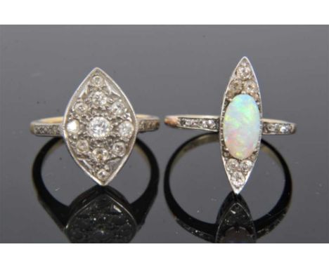 18ct gold opal and diamond marquise shape ring with a central opal cabochon surrounded by old cut diamonds and further diamon