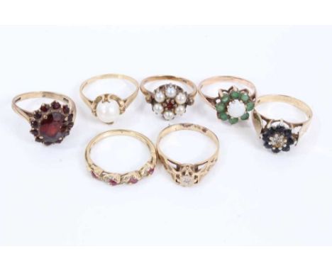 Seven 9ct gold gem set rings to include garnet cluster, opal and emerald cluster, sapphire and diamond cluster, ruby and diam