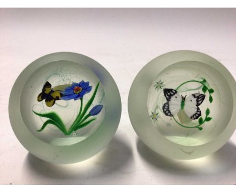 Two Caithness glass paperweights with butterfly ornamentCondition report: Some light scratching and one with a tiny fleabite.