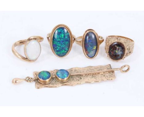 Four 9ct gold opal and opal doublet rings, together with a 9ct gold opal doublet pendant, 7.3cm longCondition report: Total w