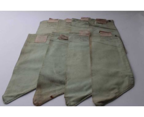 Eight Second World War British military canvas webbing water filter bag, stamped with broad arrow and AF0005, Baynell Ltd, 19